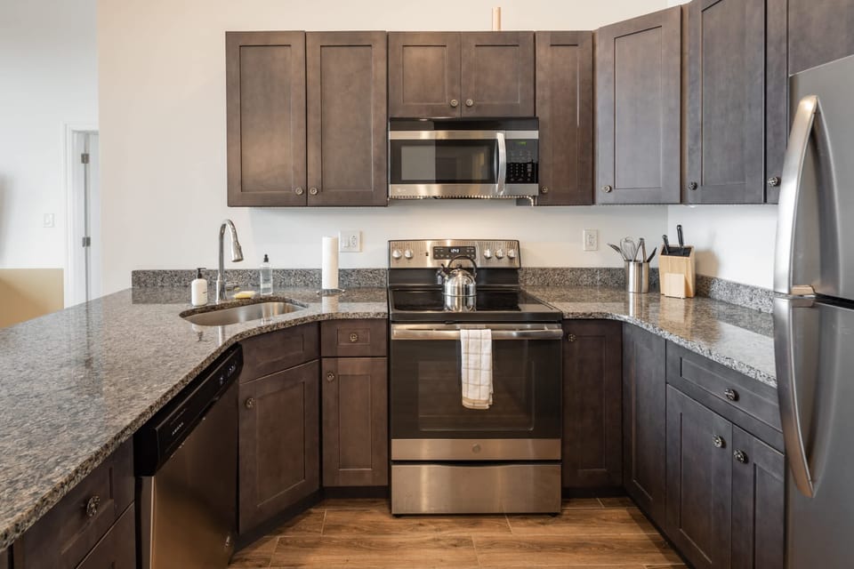 Enjoy home-cooked meals or that tasty take out with this lovely kitchen with a full-sized refrigerator