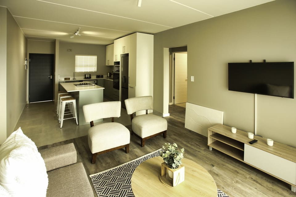 Family Apartment | Living area | 53-inch flat-screen TV with satellite channels