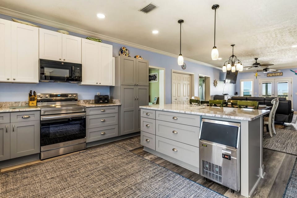 Your spacious kitchen features modern appliances, granite counters, and an open layout perfect for cooking memorable meals together.