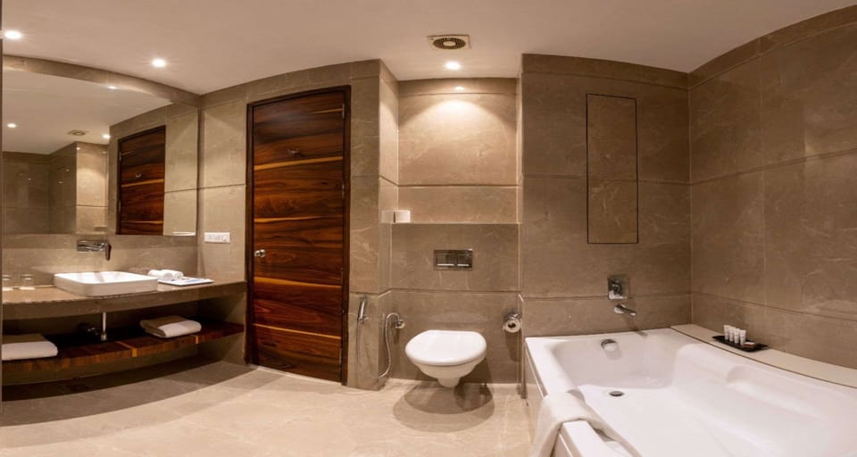 Executive Suite, 1 King Bed, Non Smoking, City View | Bathroom | Designer toiletries, hair dryer, slippers, bidet