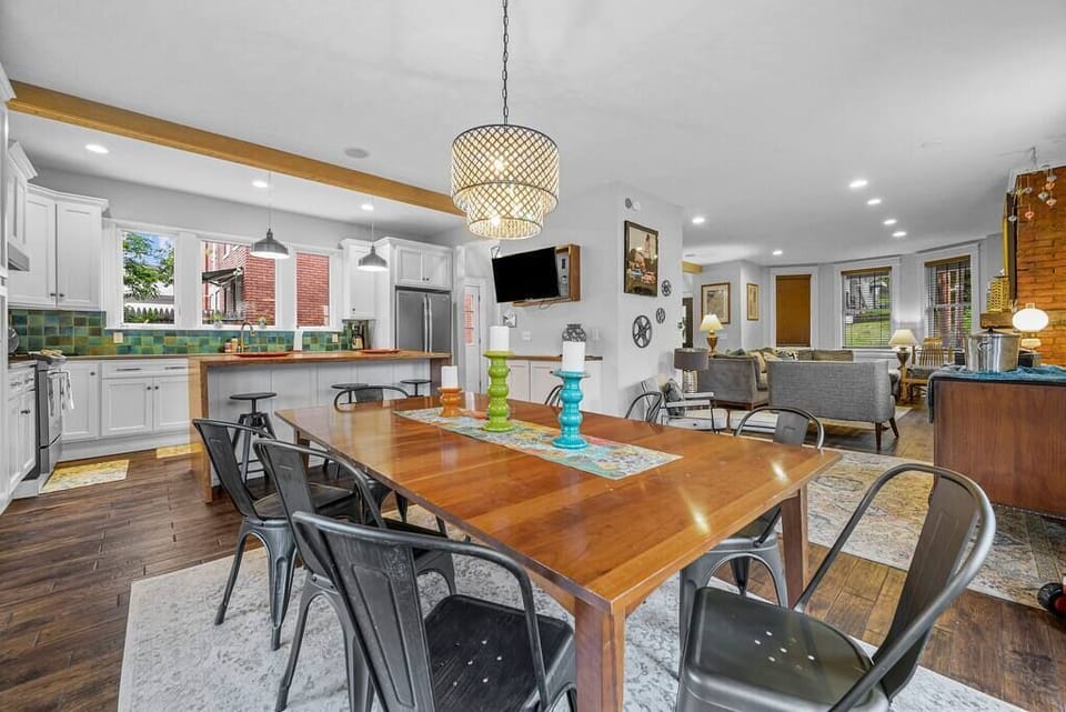 A large family table and openness into the kitchen Island area make gathering with friends and family something special!