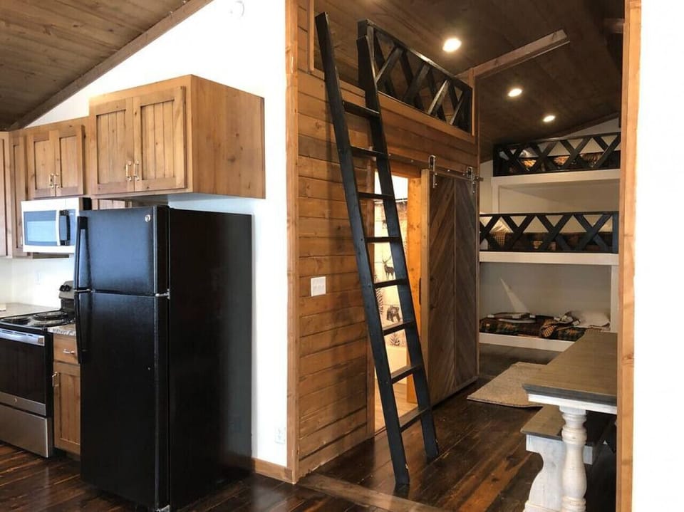 Upper kids play area with a ladder to access it