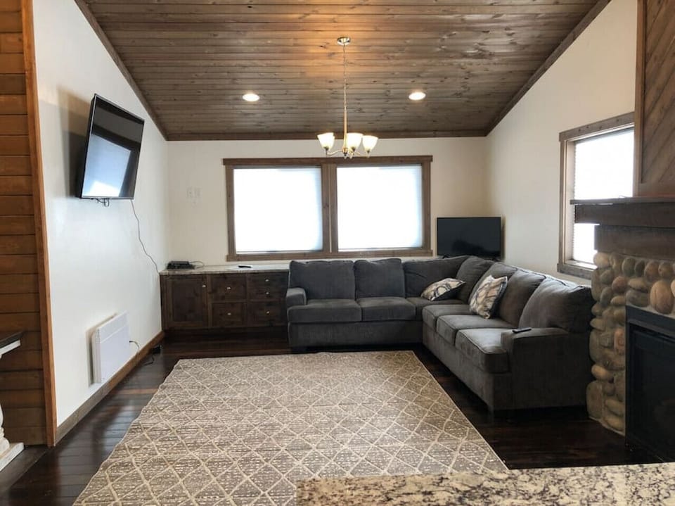 Living room area with smart TV and gas fireplace