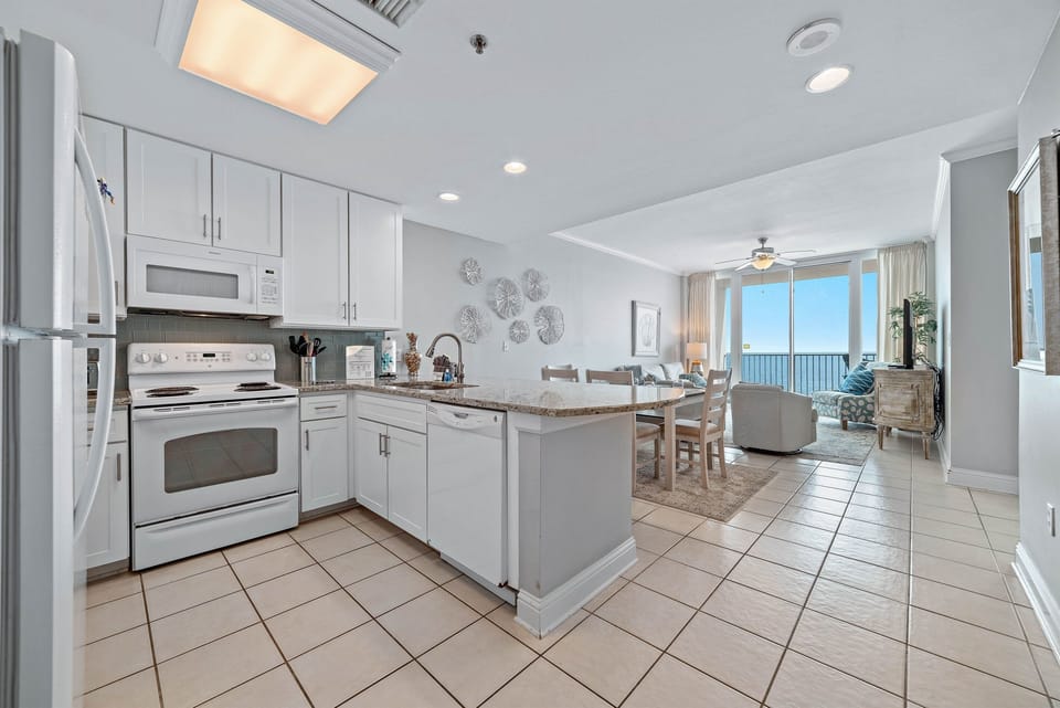 Bright and airy kitchen with ample counter space and modern amenities, creating an inviting space for cooking and gathering.