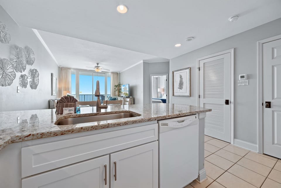 Perfect ocean views, clean lines and modern finishes define this well-appointed kitchen, offering a sleek and stylish cooking environment.