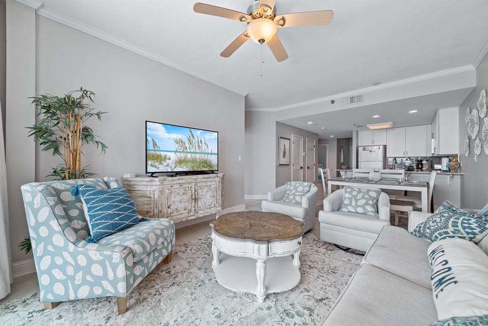 This well-appointed living space offers plush seating, elegant coffee table, and a dining area with seating for six, creating a welcoming atmosphere.