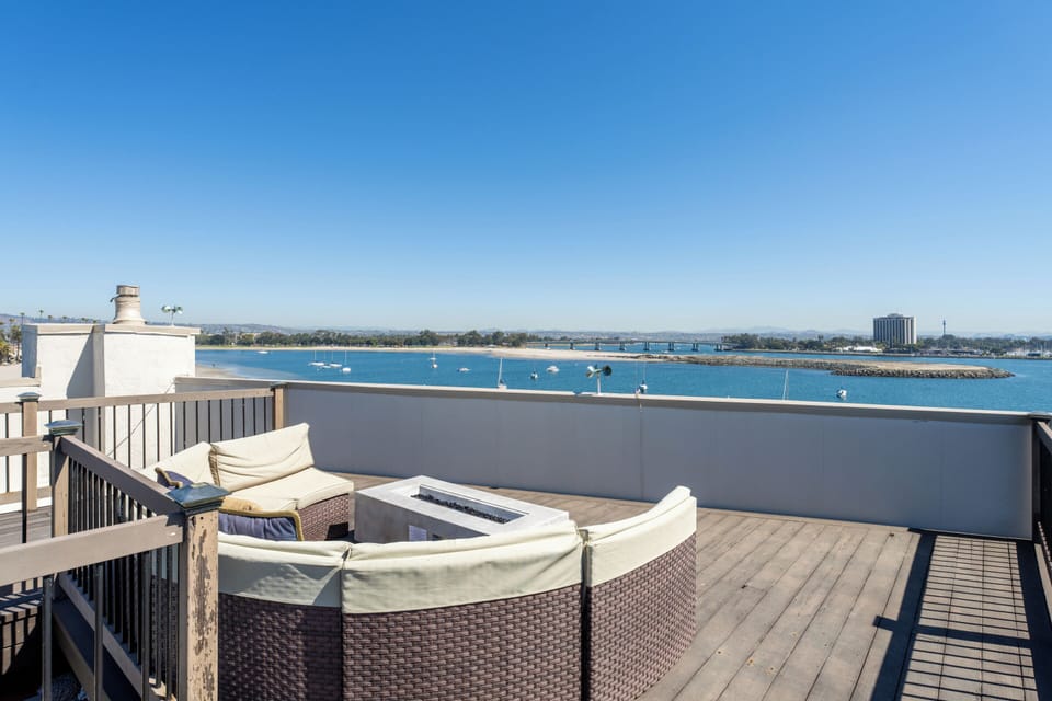 Roof Deck w/ Bay Views & Fire Pit, outdoor dining area, sun loungers and propane BBQ grill