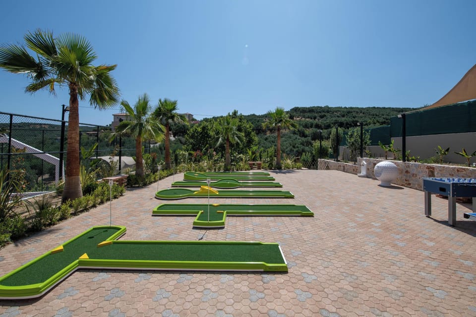A private mini golf court so you can practice your skills, a ping pong table, and a foosball table.