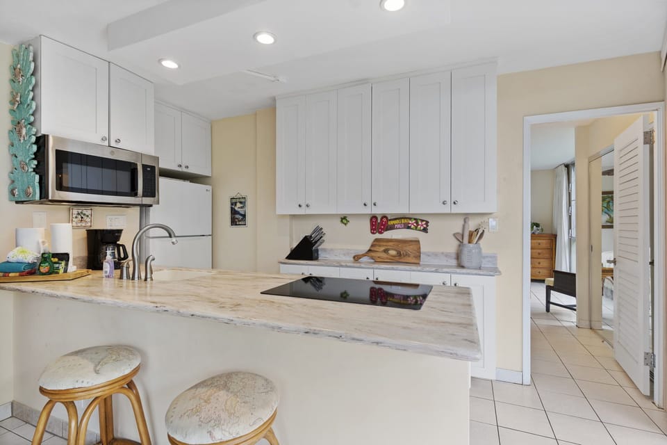 Fully equipped kitchen stocked with cookware and utensils  