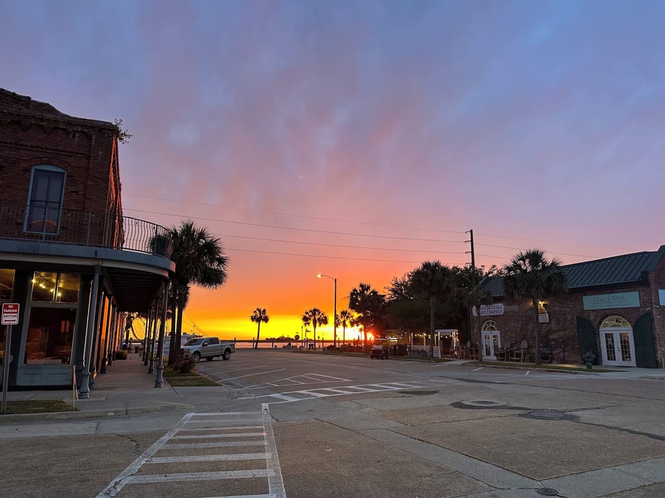 Sunsets over the water from our corner