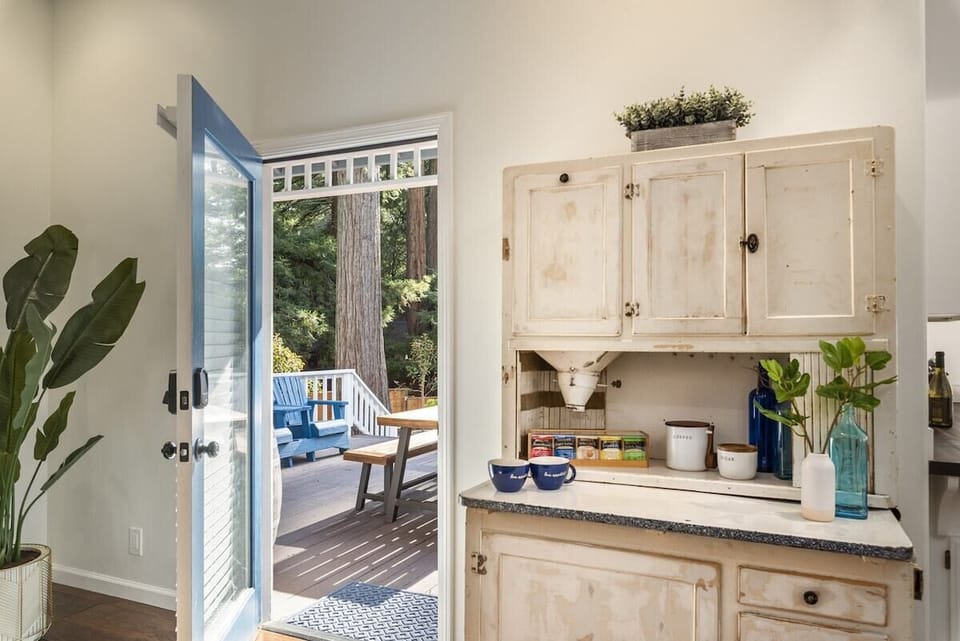Side door exiting out to the veranda and sundeck with coffee and tea station adjacent. 