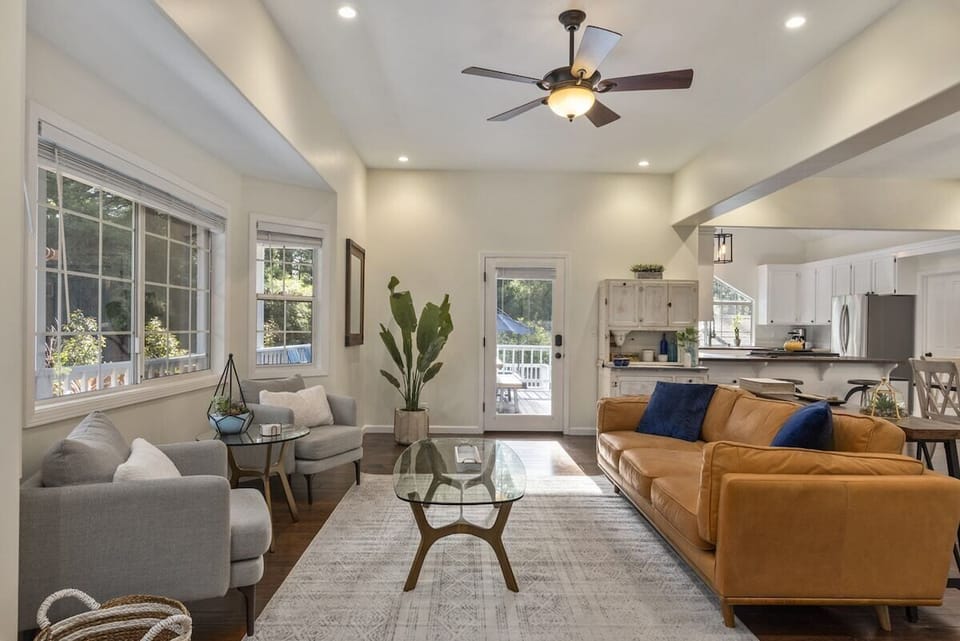Your sun-lit Great Room features a tasteful sitting space to enjoy catching up with friends and family. High end furnishings from Crate & Barrel, and West Elm bring comfort and modern style to this space built for you.  