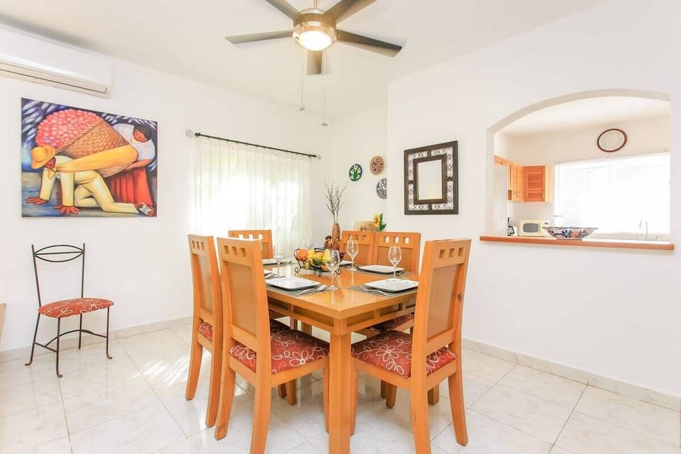 The dining room is adjacent to the living room & seats 6 for meals at home