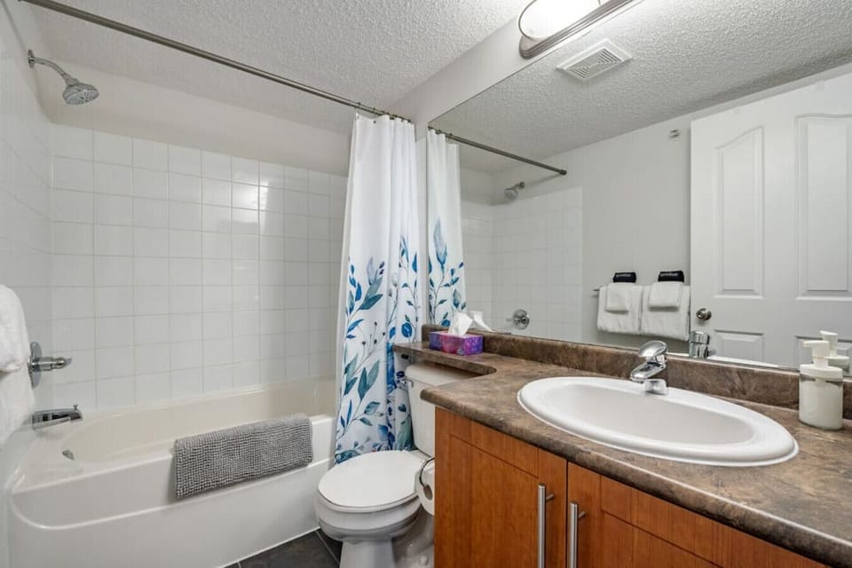 Second full bathroom with a shower/tub combo. Each bathroom comes stocked with towels, a hair dryer, shampoo, conditioner & body wash.