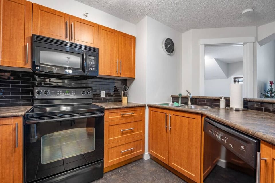 Full kitchen with a drip coffee machine, ground coffee, tea, sugar and basic condiments (ketchup, mustard and relish.)