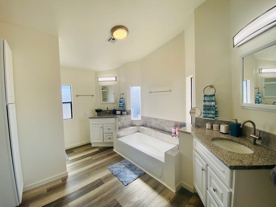 Primary bathroom has separate tub and shower