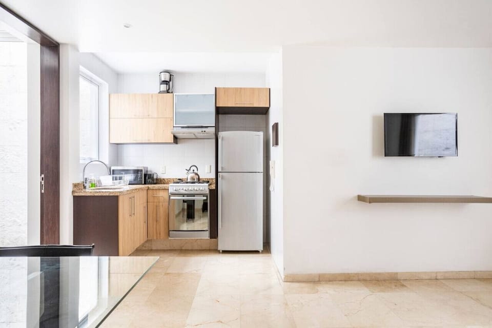 Refrigerator, stove, microwave, coffee maker, blender, utensils, cutlery, pots, pans