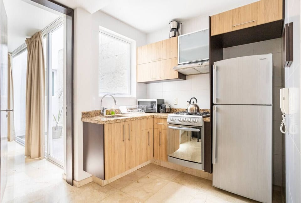 Refrigerator, stove, microwave, coffee maker, blender, utensils, cutlery, pots, pans