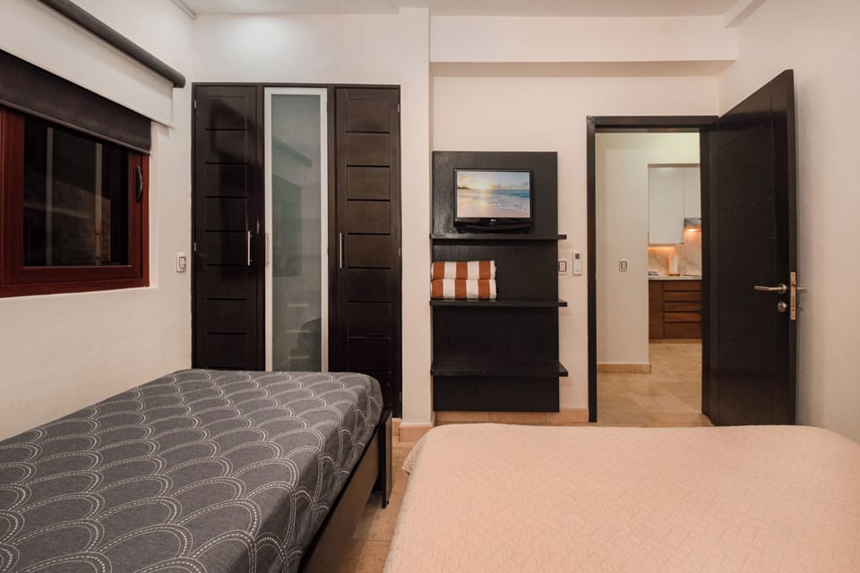 Guest Bedroom - Drift asleep each evening to TV shows and movies.