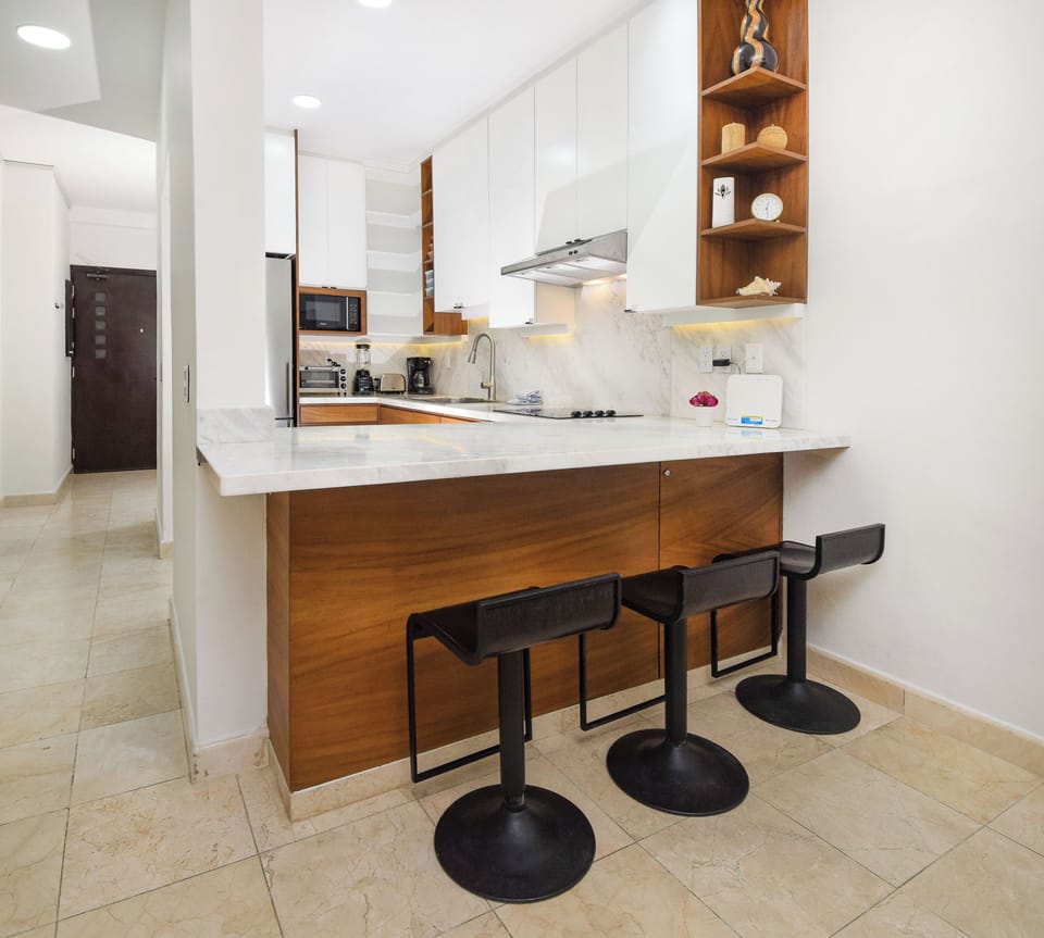 Our fully functional kitchen offers modern amenities and appliances for your convenience.