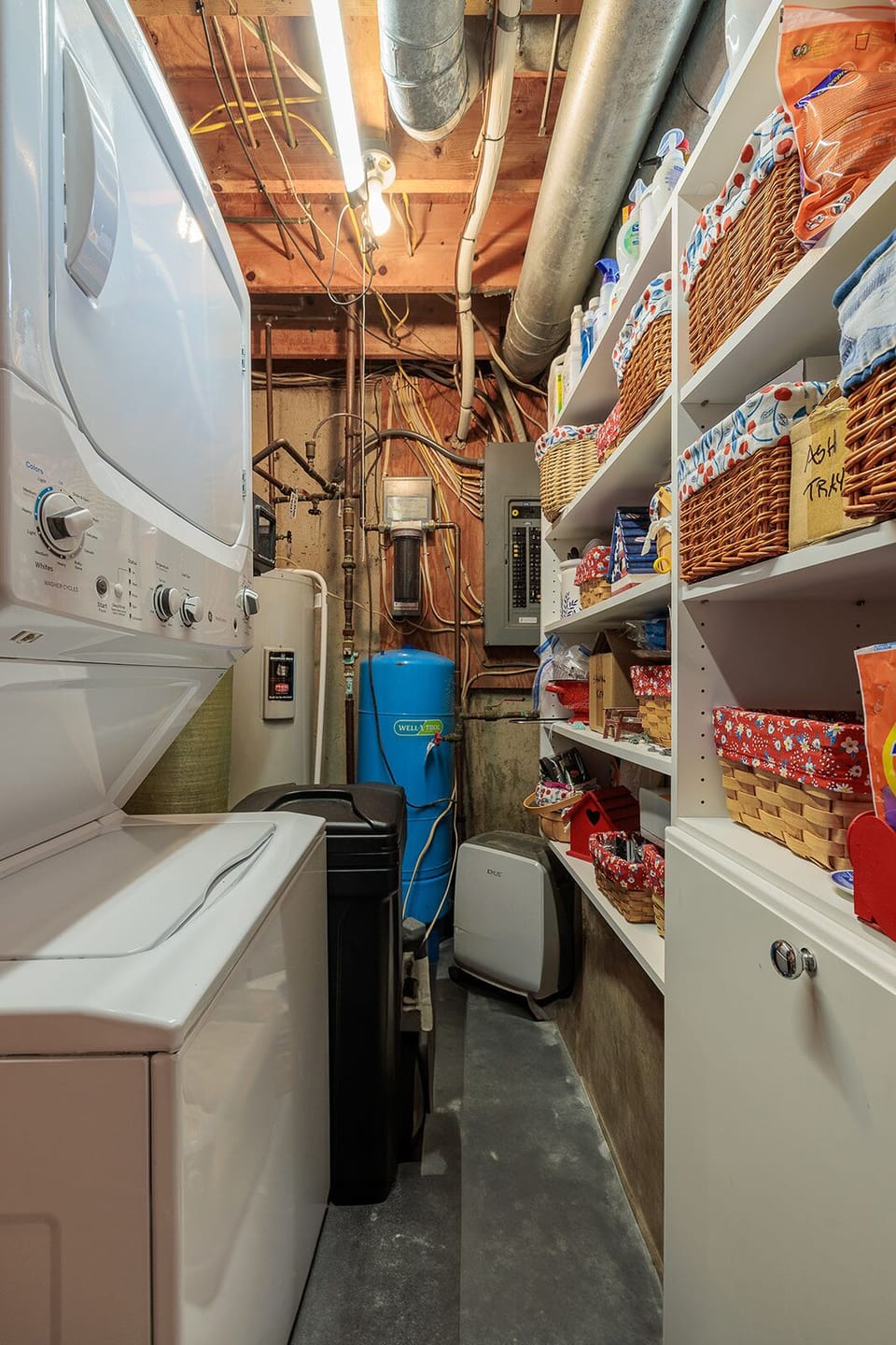 Compact utility/laundry room in basement - everything to wash & dry clothes.