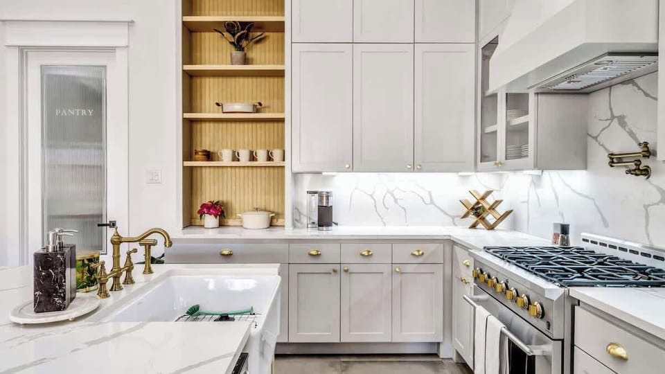 Start your day brewing coffee in this stunning kitchen, where every detail invites warmth and togetherness. Cook with ease, gather at the island, and share meals that turn into lasting memories in this elegant yet inviting space.