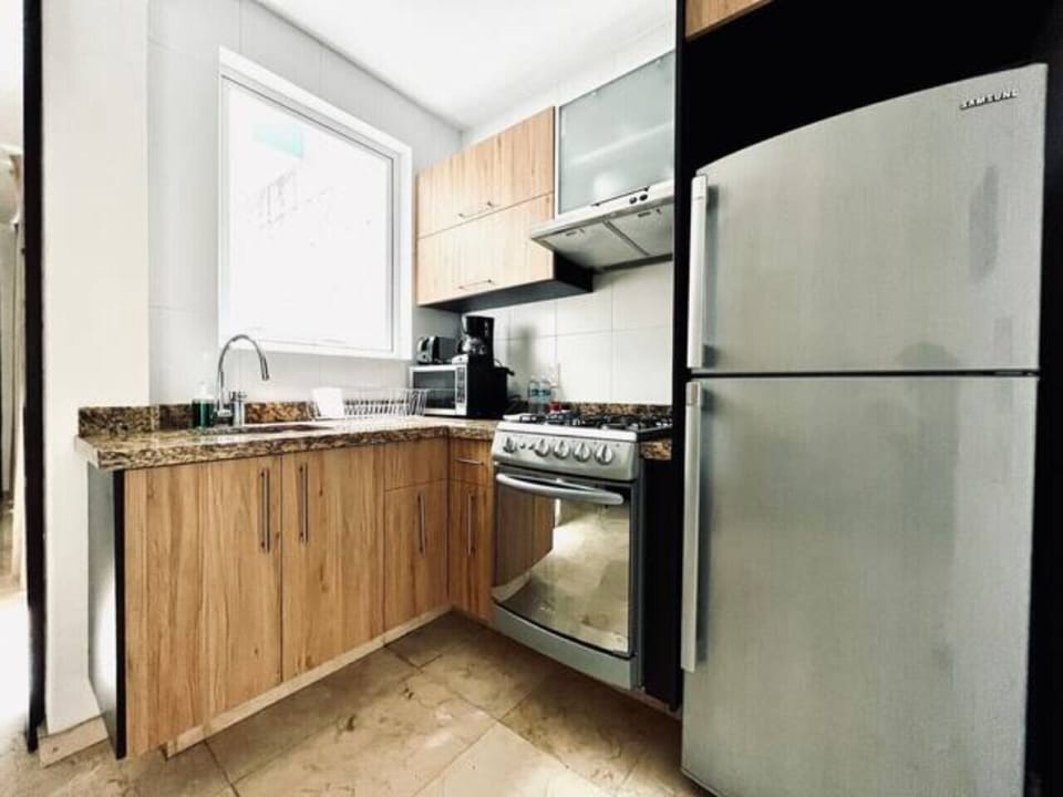 Refrigerator, stove, microwave, coffee maker, blender, utensils, cutlery, pots, pans