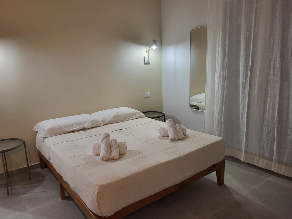 Deluxe Quadruple Room | Desk, blackout drapes, iron/ironing board, free WiFi