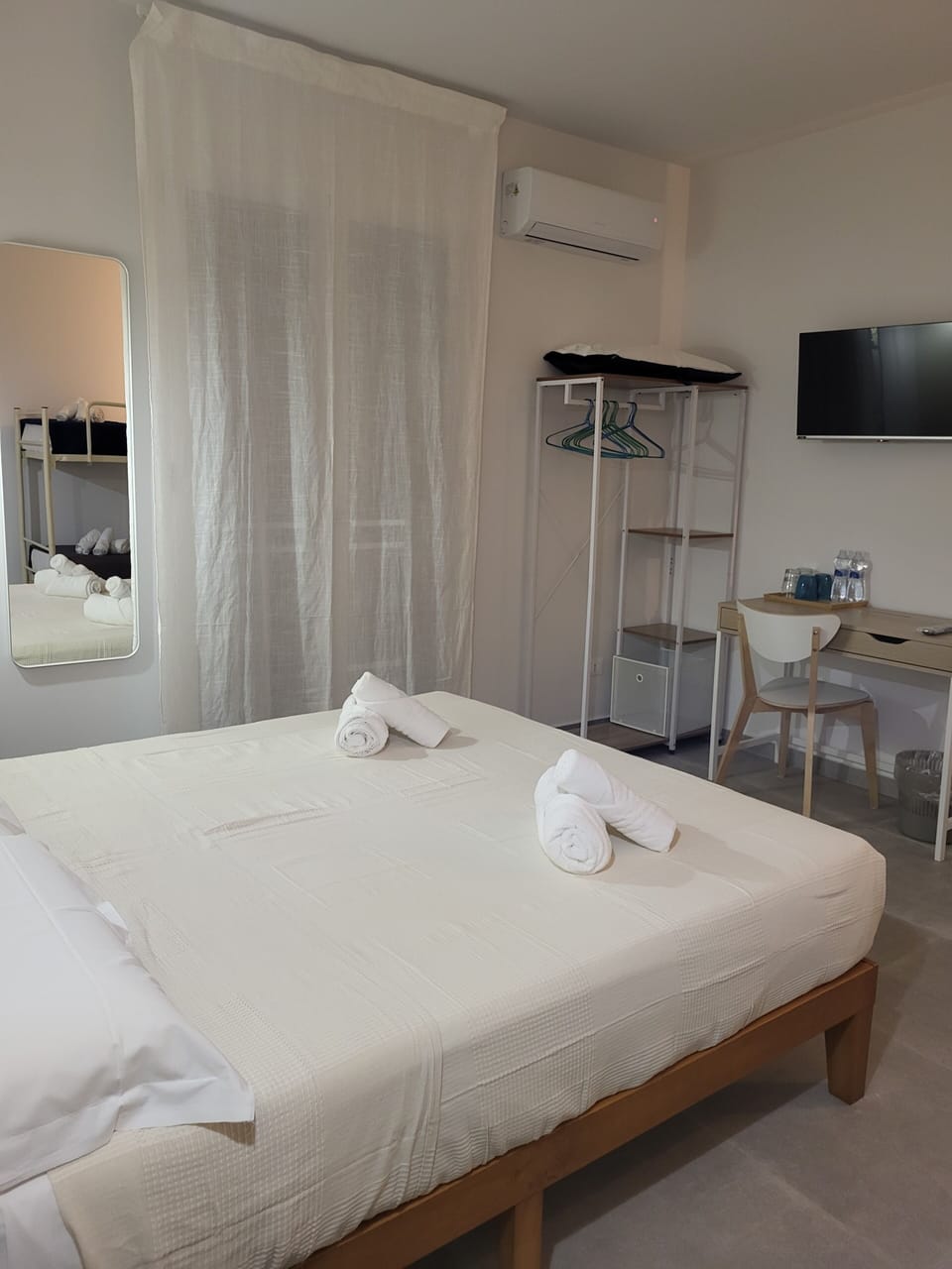 Deluxe Quadruple Room | Desk, blackout drapes, iron/ironing board, free WiFi