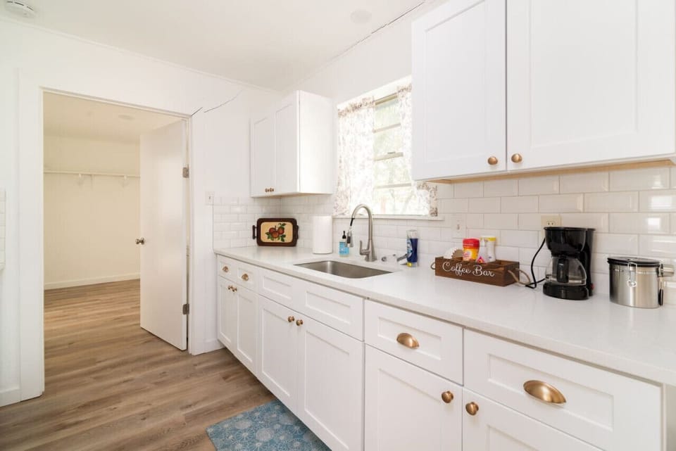 Bright, fully equipped kitchen with modern finishes and plenty of counter space