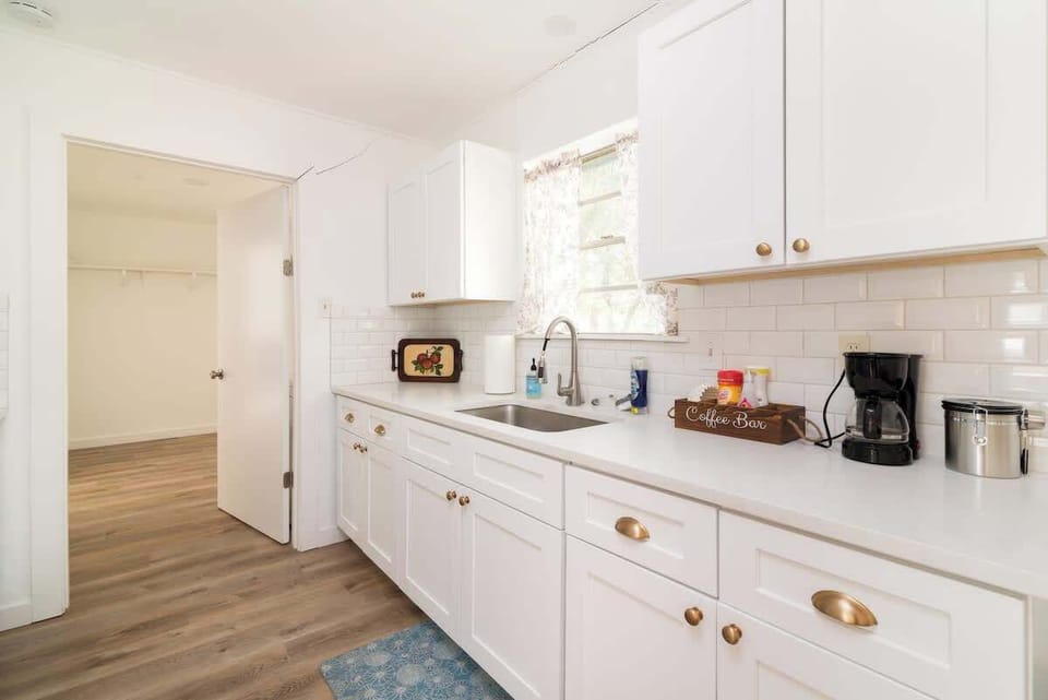 Bright, fully equipped kitchen with modern finishes and plenty of counter space