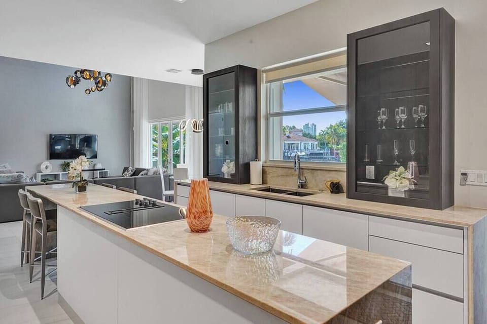 Modern kitchen with sleek countertops and high-end appliances. Perfect for preparing gourmet meals.