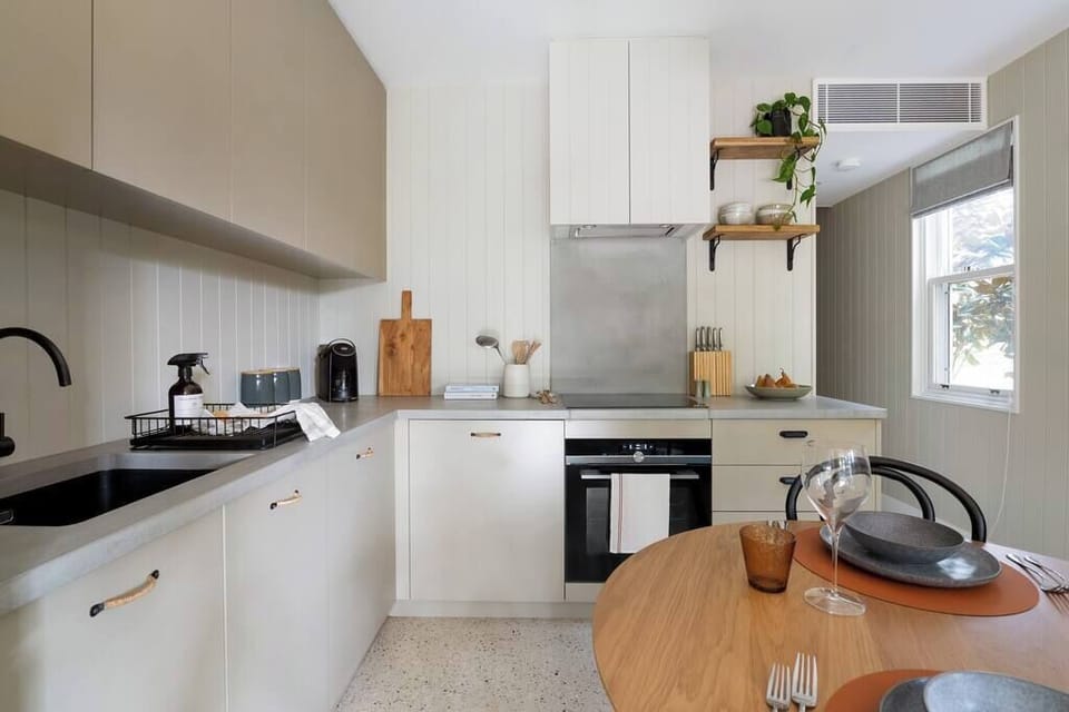 Kitchen with fridge, freezer, coffee pod machine, toaster, kettle, microwave, stove top and oven. All cookware and utensils provided.