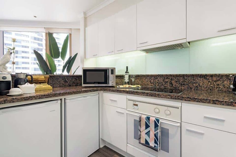 Kitchen facilities with electric stove and oven, microwave, fridge / freezer, dishwasher, coffee Machine, milk warmer, kettle, toaster, all cook-ware and cutlery provided.