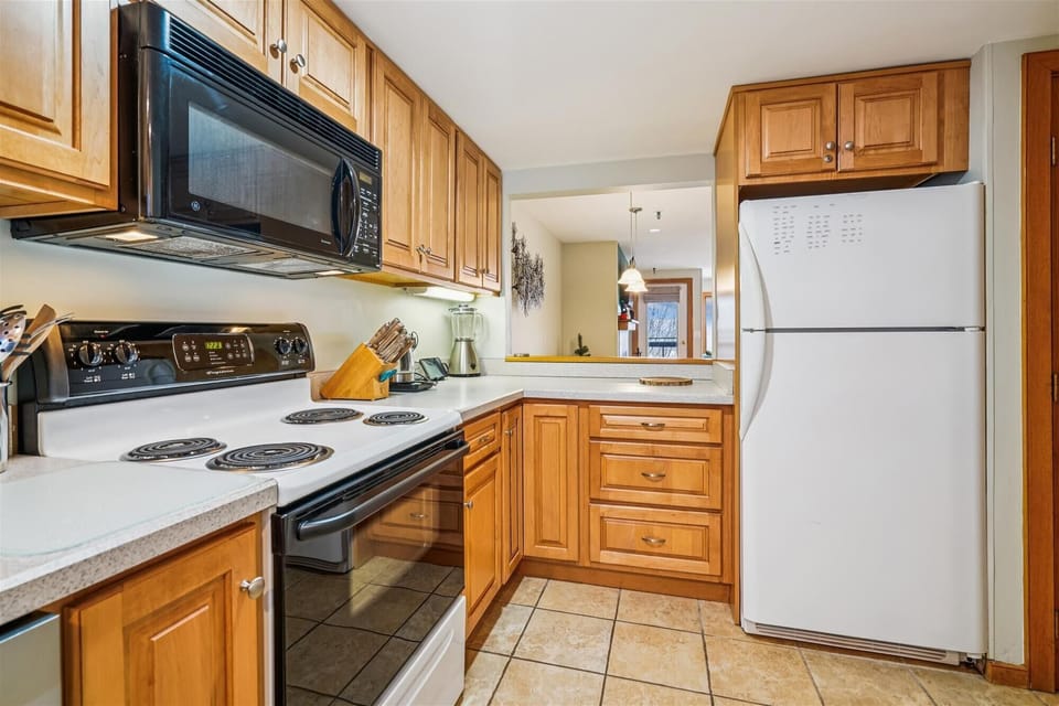 The kitchen features full-size appliances and everything needed to prepare meals during your stay.