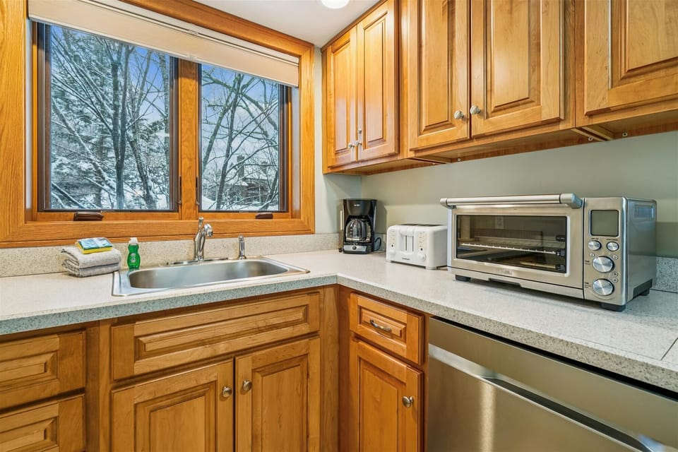 Bright kitchen with generous counter space, full appliances, and a window that brings in natural light while you cook.