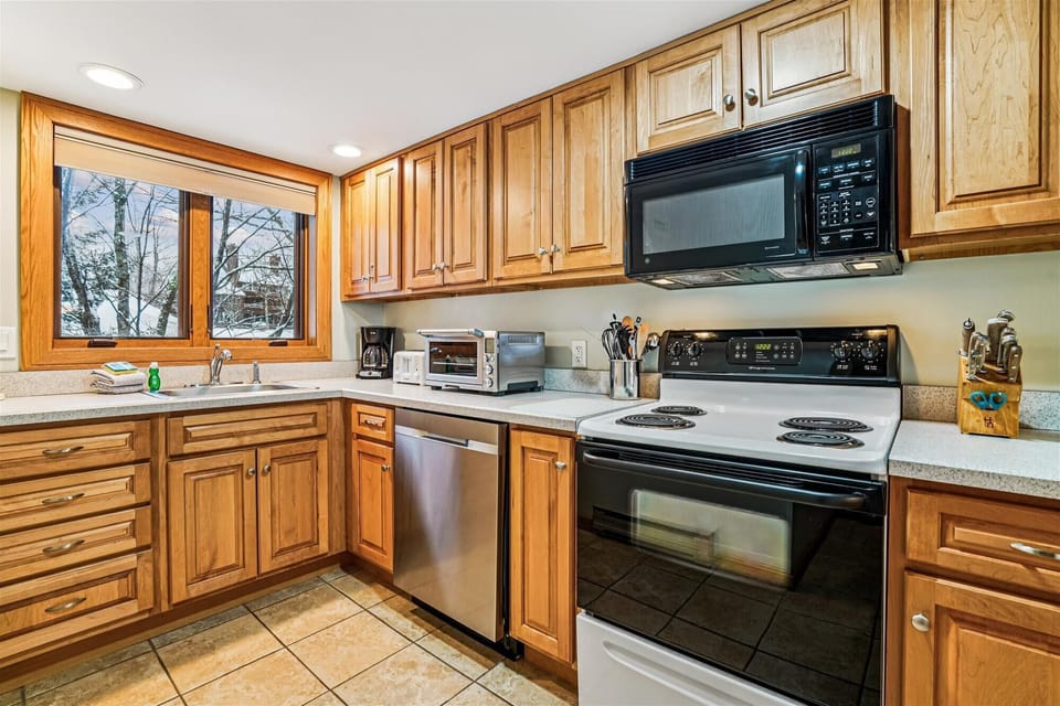 The kitchen offers full-size appliances, generous cabinet space, and everything needed to prepare meals during your stay.