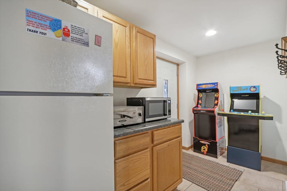 Lower level "kitchenette" with a full size fridge and a pizza maker!