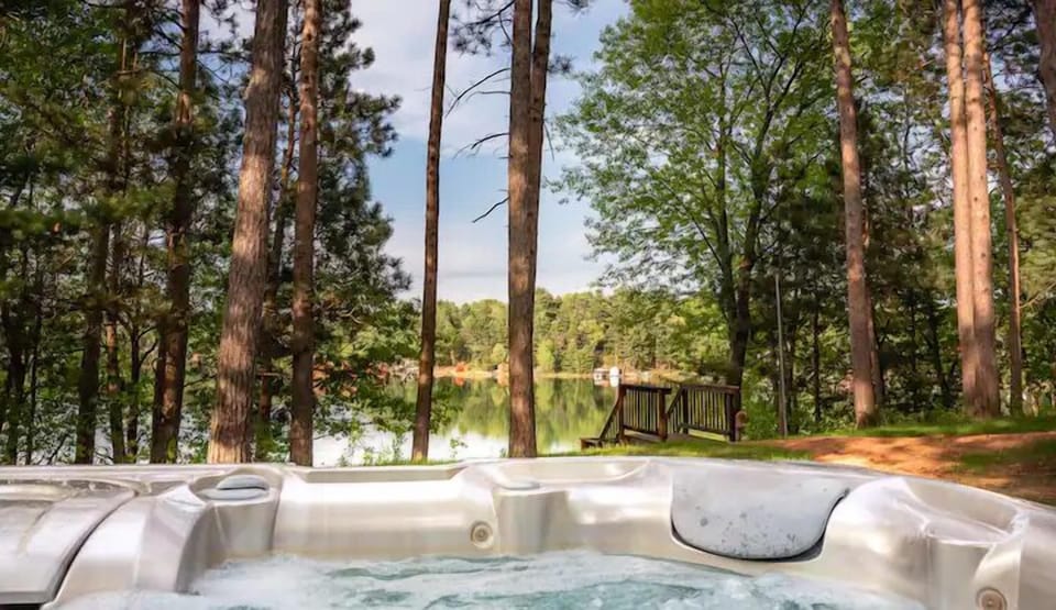 Private hot tub surrounded by trees — relax after a day on the lake (year-round use)