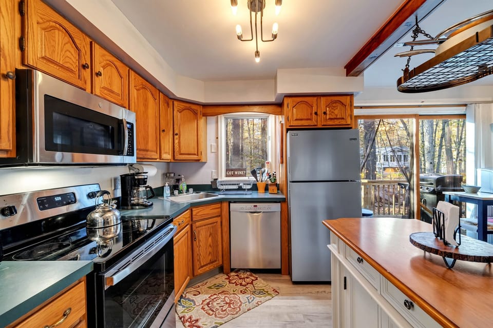 Cozy kitchen equipped with stainless steel appliances, offering a modern and efficient space for preparing meals