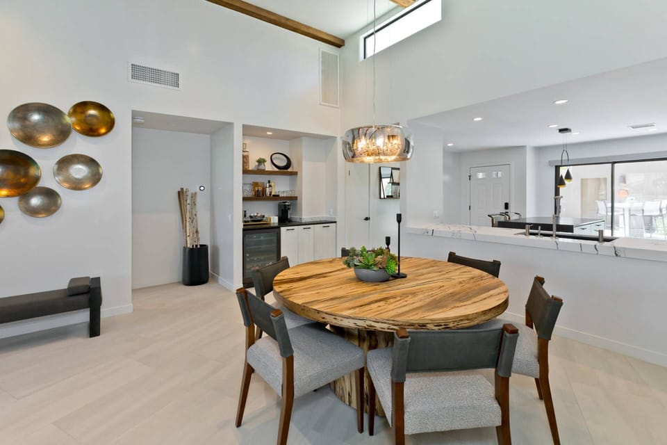 Dining Room Features a Bar with a Wine Fridge