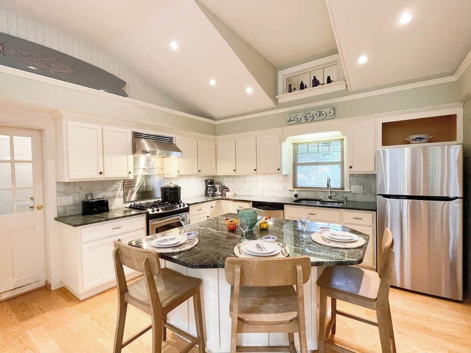 Bright, open kitchen with gourmet gas stove