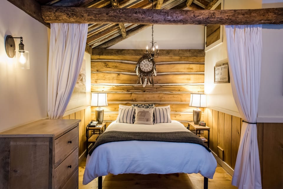 Cabin (Tiny, Offsite) | Desk, blackout drapes, iron/ironing board, cribs (free)
