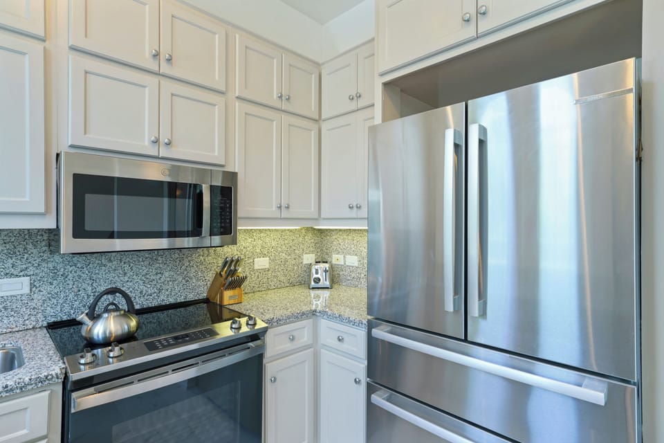 KITCHEN W/LARGE DOUBLE DOOR FRIDGE, CUSTOM CABINETS
