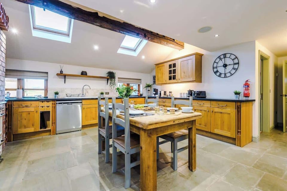 The large kitchen is fully equipped with everything you need for your long or short stay with us. There is a full smeg range cooker, gas hob, American fridge freezer, dishwasher, Nespresso Coffee machine, microwave, toaster, washing machine & dryer. 
