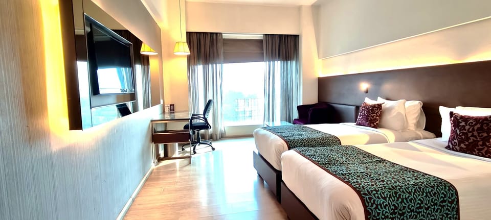 Deluxe Twin Room | In-room safe, desk, blackout drapes, iron/ironing board