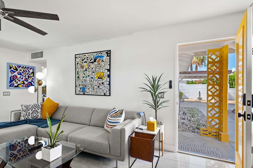 Living Room: Stylish Palm Springs house with vibrant mid-century decor and luxury amenities