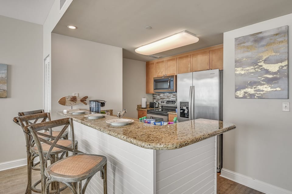 The updated kitchen has granite countertops, stainless steel appliances, and is fully stocked with more than the basics (coffee/tea bar, oils/spices, Tupperware, plenty of pots/pans/cookware) so you and your group can prepare delicious Gulf front meals!