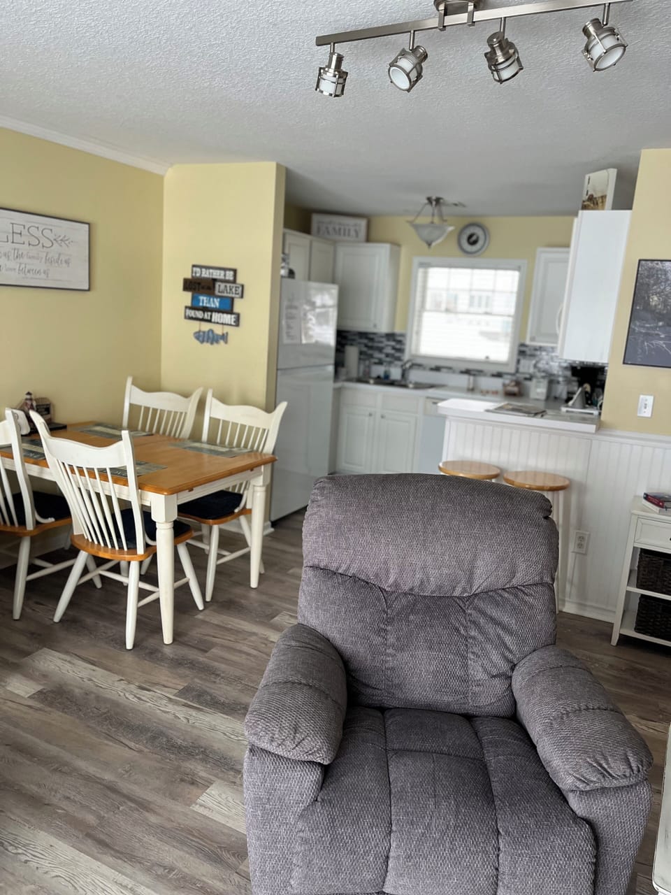 New vinyl flooring in living room,  kitchen, entry and hall.