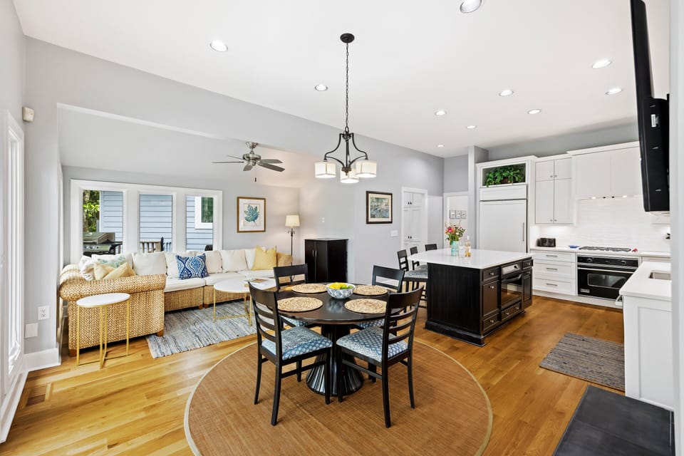 Open concept- sitting area, dining table, and kitchen. Perfect to conversate!